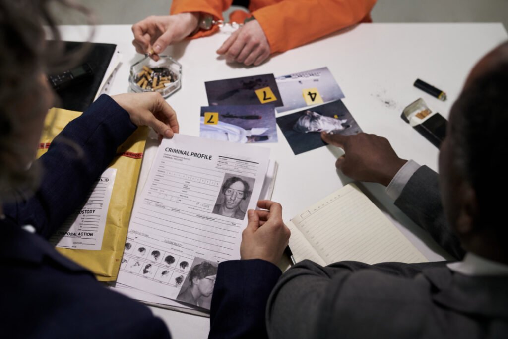discussing case files criminal investigation 1080x720 1