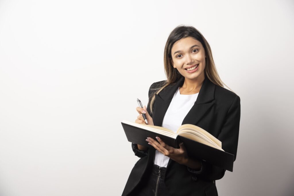 young businesswoman holding opened clipboard with pencil 1 1024x683 1